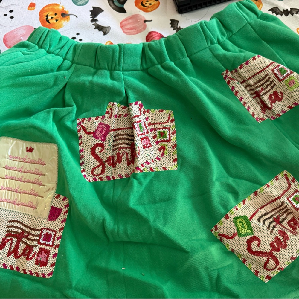 QUEEN OF SPARKLES Green Athletic Shorts with Santa Patches